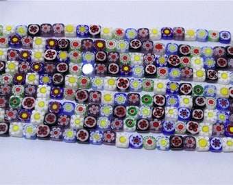 a string of 65 pcs beads millefiori glass flattened square multicolor