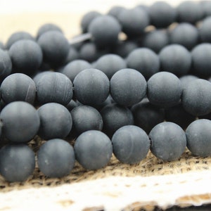 a string of 48 pcs beads onyx effect mate natural round 8mm