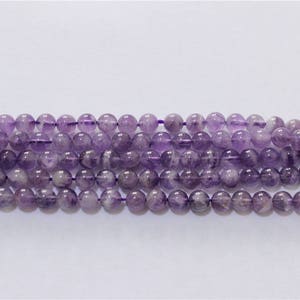 a string of beads amethyst stone round 6mm approx 64 pcs