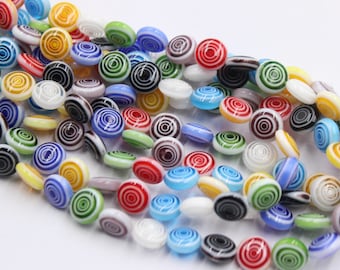 a string of 43 pcs beads millefiori glass flat-round 10,5mm spiral multicolor