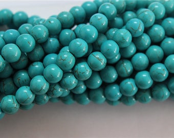 un fil de 54 perles en turquoise ronde 8mm