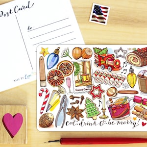 May include: A postcard with the words "Post Card" and "to" printed on it, along with a decorative card featuring Christmas-themed illustrations. The decorative card includes images of a train, candy canes, and the text "eat, drink & be merry!"