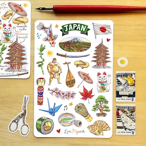 May include: A rectangular sticker sheet featuring colorful illustrations of Japanese cultural icons including Mount Fuji, a koi fish, a sumo wrestler, a pagoda, a maneki-neko, a katana, sushi, a bonsai tree, and the text Japan and Lou Paper.