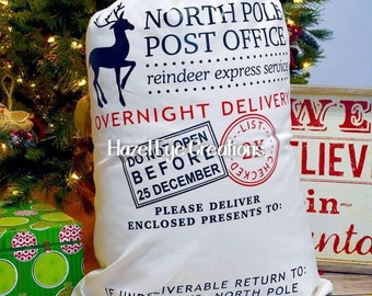May include: White Santa sack with black and red text that reads "North Pole Post Office, reindeer express service, Overnight Delivery, Do Not Open Before 25 December, Please Deliver Enclosed Presents To: If Undeliverable Return To: Santa Claus, North Pole".
