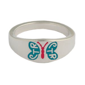 May include: A silver ring with a teal butterfly design. The butterfly has the letters CTR on each wing and a red body.