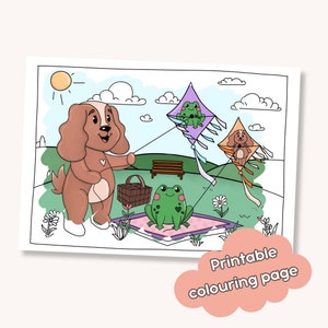 Puede incluir: Una página para colorear imprimible con un perro marrón que sostiene una cesta de picnic, dos ranas verdes y dos cometas. Una cometa tiene forma de diamante y la otra tiene forma de corazón. El perro lleva un collar rojo con un corazón. Las ranas están sentadas en una manta rosa y blanca. Las cometas vuelan en el cielo con nubes y un sol.