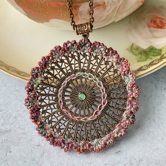 Bronze Filligree Medallion Pendant Necklace - Mixed Media - Pink Raspberry Mauve Green - 24 inch chain- Glass Beads - Crochet - Embroidery