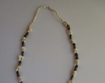 Vintage shell necklace,brown spotted and cream shells, alternating clusters of 6 and 2 except for  in neck area single shells for comfort