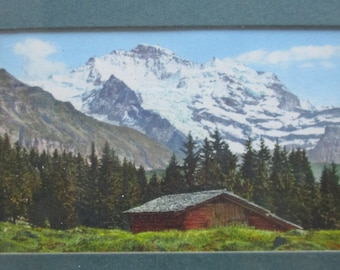 Art print of landscape,house,below mountain,sky,clouds,Alpine scene,excellent condition,green,white frame with glass,good condition,9 "x 7"