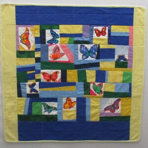 Lap quilt,contemporary modern,babyquilt,multicolored butterflies surrounded by blue,yellow,green cotton,reversible, inspired by Gees Bend
