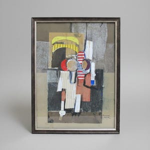 May include: A framed mixed media collage artwork featuring layered paper elements in yellow, red, white, and black. The composition includes geometric shapes, striped patterns, and textured surfaces within a dark brown frame. A signature is visible in the bottom right corner.