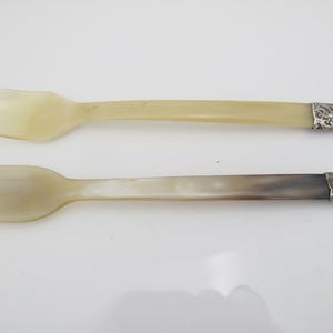 May include: A rustic wooden sign with the text "Welcome to our home" in white lettering. The sign features a distressed finish and a simple, inviting design, perfect for a front porch or entryway.