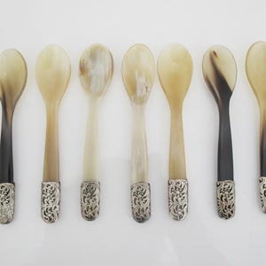 May include: A rustic wooden sign with the text "Welcome to our home" in white lettering. The sign features a distressed finish and a simple, inviting design, perfect for a front porch or entryway.