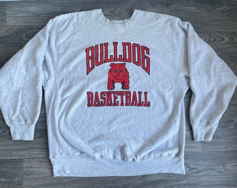 Sudadera de baloncesto Georgia Bulldogs estilo vintage de los 80, color arena, tipo pullover, con el logo de la universidad en la entrepierna, fabricada en EE. UU., talla XXL.