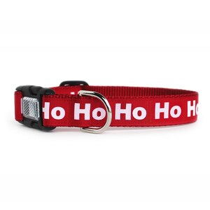 A red Christmas dog collar with white ho ho ho text and optional reflective buckle.