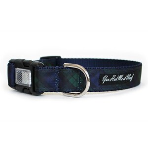 Scratch resistant plaid dog collar in navy blue, green, and black plaid, with an optional reflective buckle for visibility.