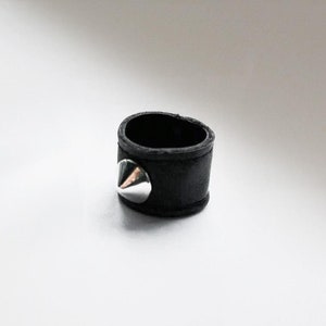 Vegan black faux leather double-layer ring with a silver-tone cone stud