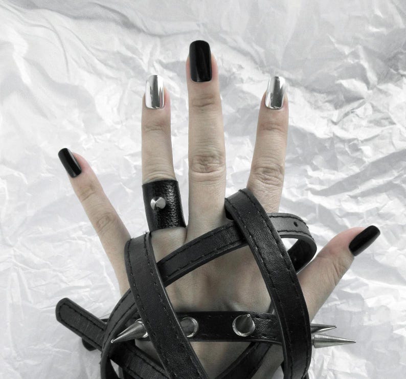 black leather ring with spike  unique goth gift idea, combining style with a studded ring band for anyone into bold, edgy accessories.