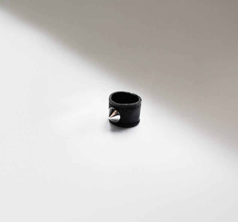 Vegan black faux leather double-layer ring with a silver-tone cone stud