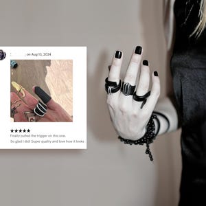 dramatic finger cuff with metal hoops makes a unique jewelry gift idea for individuals who value innovation and creativity