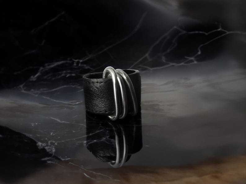 Avant-Garde Black Leather Ring is perfect for urban trendsetters seeking cutting-edge jewelry