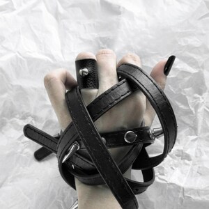 This ring combines vegan black faux leather with a statement cone stud, making it a versatile, modern piece for daily wear or special occasions