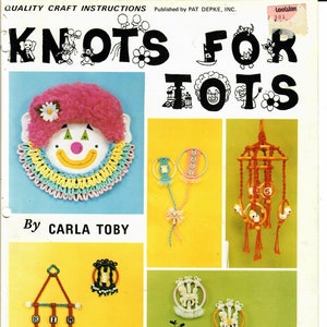 May include: A book cover with the title "Knots for Tots" in black letters on a yellow background. The cover features illustrations of a clown, a horse, and a mobile. The book is by Carla Toby and published by Pat Depke, Inc.