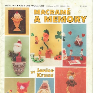 May include: A vintage craft book cover with the title "Macrame A Memory" by Janice Kress. The cover features colorful macrame projects, including a clown, a snowman, a heart, and a leprechaun.