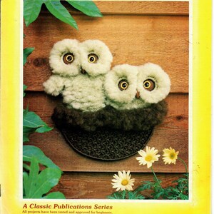May include: A vintage craft book cover featuring two fluffy white owls with brown eyes, perched on a brown crocheted circle. The book title is "Tie The Knot with Classic" and the subtitle is "A Classic Publications Series". The book cover is yellow with green leaves in the background.