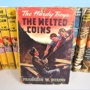 Hardy Boys &quot;The Melted Coins&quot; w/Dust Jacket - Vol. 23- Franklin W. Dixon- Brown Cover- Orange Gretta EPs - 1944 Text- Grosset & Dunlap