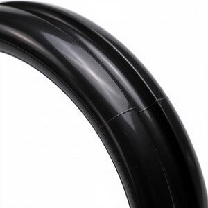 Close-up of black rubber spinner ring for bartender bottle openers