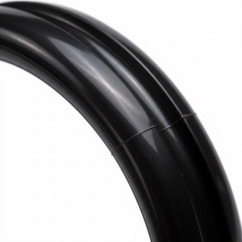 Close-up of black rubber spinner ring for bartender bottle openers
