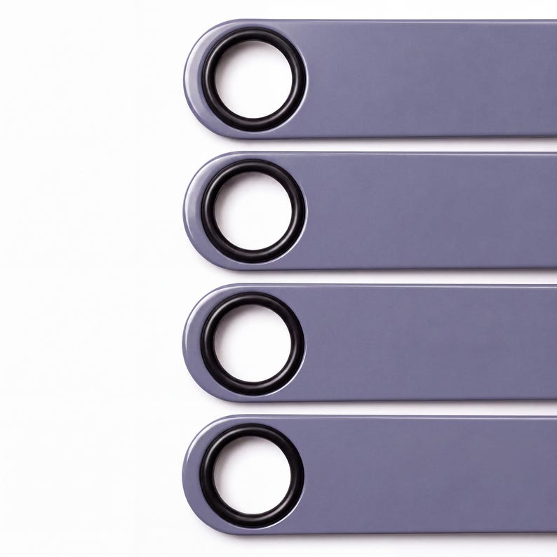 Four lilac bartender bottle openers with black rubber spinner rings