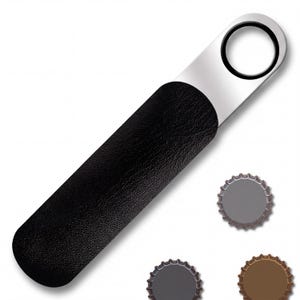 Silver bartender bottle opener with black rubber spinner ring inside a black protective leather pouch, and three bottle caps arranged on white background