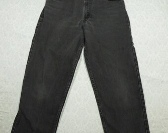 Vintage Levi's 550-jeans: zwart relaxte pasvorm, taps toelopende pijpen (34 x 34)