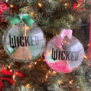 Wicked Christmas Ornament: Green “Wicked” Witch Ornament with Broom + Pink Good Witch Ornament with Wand – Individual or Set – Glitter