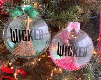 Wicked Christmas Ornament: Green “Wicked” Witch Ornament with Broom + Pink Good Witch Ornament with Wand – Individual or Set – Glitter