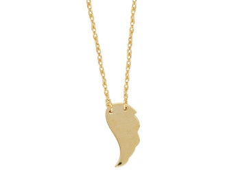 May include: A gold chain necklace with a single gold wing pendant.