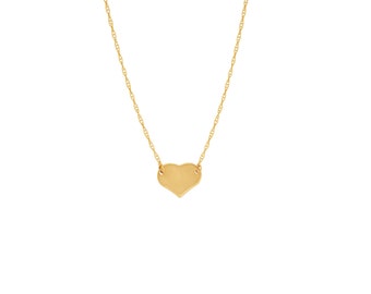 May include: A gold heart pendant necklace with a delicate chain.
