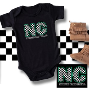 May include: Black baby onesie with a checkered green and white "NC" for North Carolina.