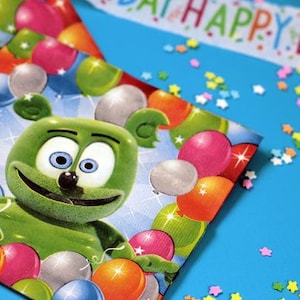 May include: A festive birthday-themed image featuring a green gummy bear character surrounded by colorful balloons. The image includes a banner that reads "HAPPY BIRTHDAY" and star-shaped confetti on a blue background.