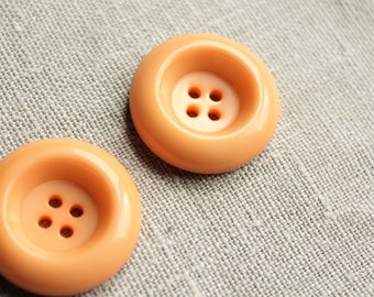 Grands boutons orange clair