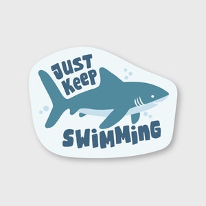 May include: A blue shark sticker with the text "Just Keep Swimming" on a white background.