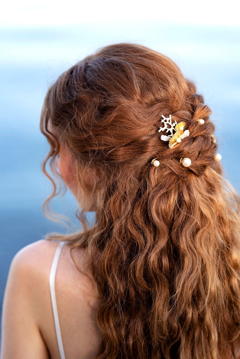 set of seven round glass pearl hair pins are hand wired onto u shaped pins.  These beautiful pins are available in various amounts as well as in Ivory, white or iridescent pearls and in silver gold or rose gold finishes.  Made in Toronto Canada