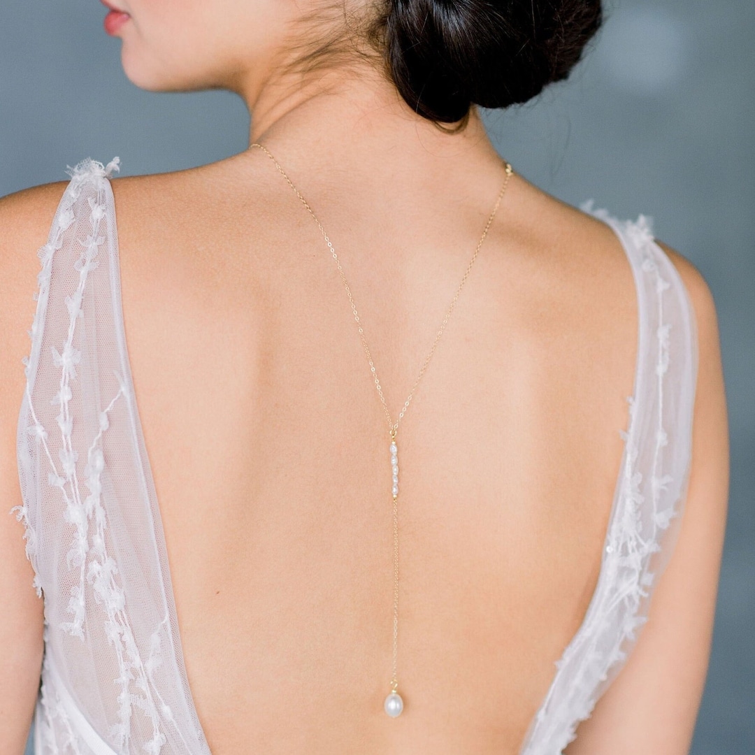 The ultimate backdrop necklace for a V-shape low back dress! This Y Lariat  CZ chain backdrop necklace is… | Backless wedding, Backless wedding dress,  Bridal dresses