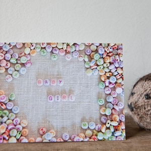 Baby Girl Card, featuring alphabet beads