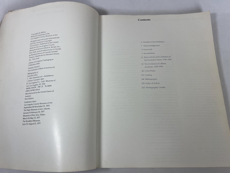 May include: An open book showing the copyright page on the left and the contents page on the right. The text includes details about the publication Two Centuries of Black American Art, exhibition dates, and a list of chapters starting with Lenders to the Exhibition, Acknowledgements, Foreword, and Introduction.