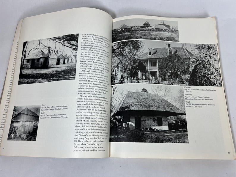 May include: An open book featuring black and white historical photographs of various architectural structures, including plantation houses and slave cabins, accompanied by columns of printed text detailing the history of these buildings.