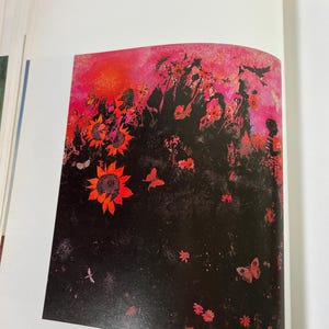 May include: A book page featuring the artwork 187 Walter Williams Southern Landscape. The print displays a vibrant pink and red sky above a dark, black foreground filled with bright orange sunflowers, small red flowers, and butterflies.