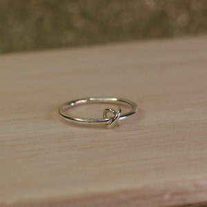 A silver fidget ring with a minimalist design.
